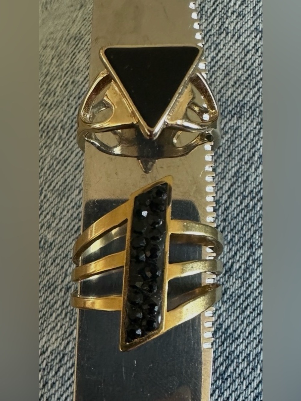 Source Unknown Gold Tone Rings with Black Stones 1st one 8 and 2nd 9